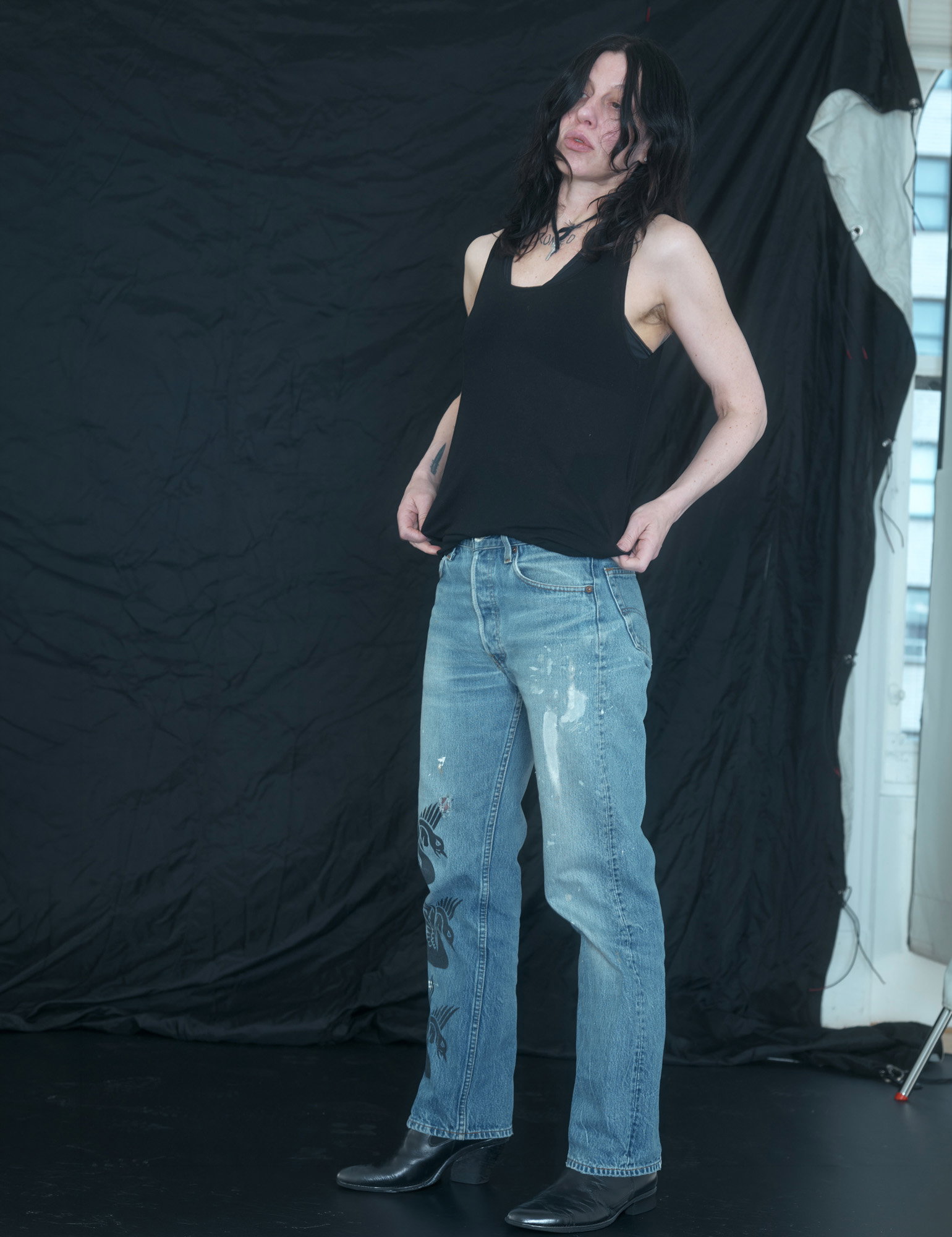 Artist Anne Imhof in her studio and a close-up of a dancer's pointed foot