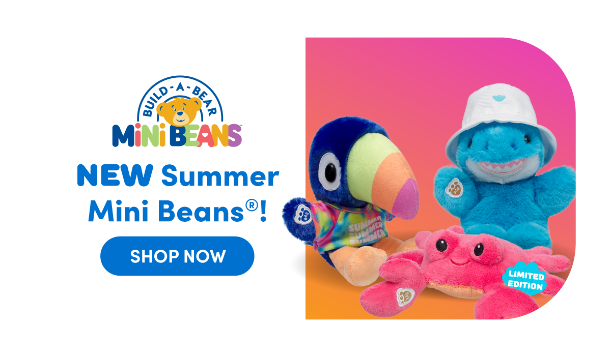 bright gradient summer background on the right featuring three Mini Beans plush. A colorful toucan wearing a rainbow shirt sits beside a blue shark wearing a white bucket hat, with a red crab plush in front marked with a small limited edition badge. Text reads: Build-A-Bear Mini Beans NEW Summer Mini Beans! SHOP NOW