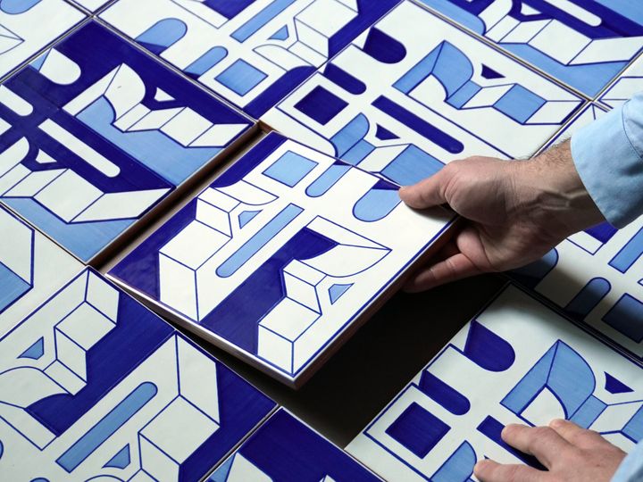 The tile becomes micro-architecture: rhythm and depth for walls