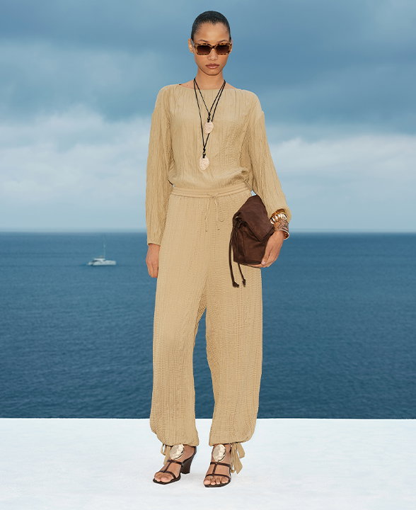 Woman wearing an Olive Textured Slash Neck Blouse and Khaki Tie Hem Crinkle Drawstring Balloon Trousers