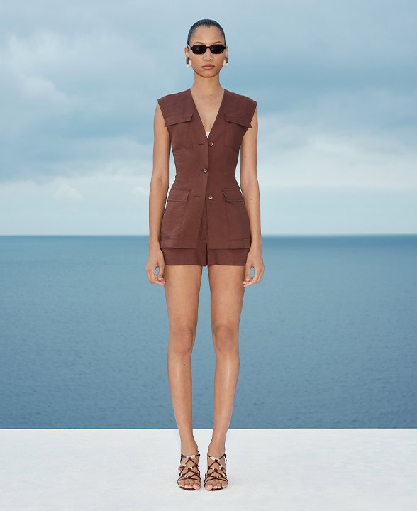 Woman wearing a Raisin Belted Utility Longline Waistcoat with Linen