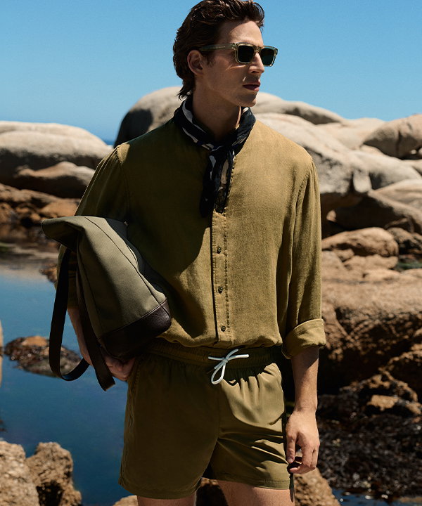 Man wearing an Olive Pure Linen Garment Dye Shirt and Quick Dry Plain Swim Shorts