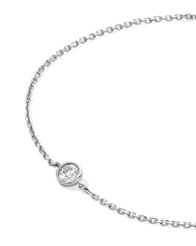 White gold solitaire bezel-set diamond bracelet.