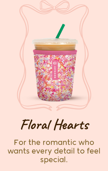 Heart-patterned tumbler with floral design.