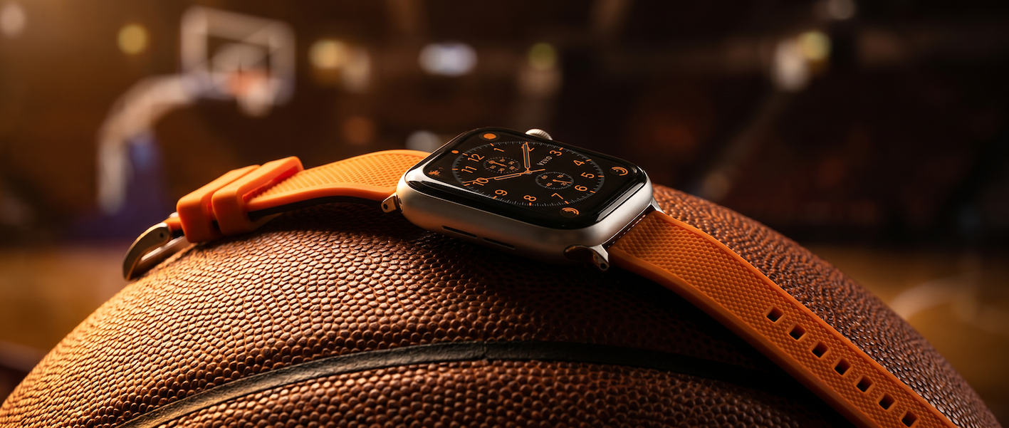 orange elite silicone band on basketball