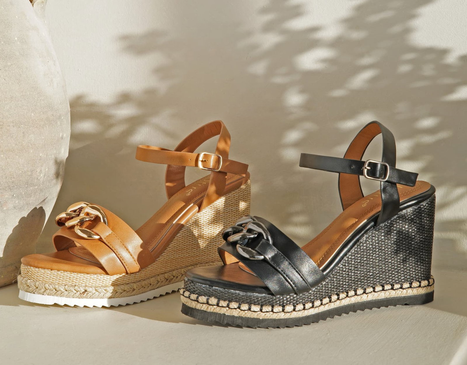 An image of two pairs of Lotus wedge sandals 