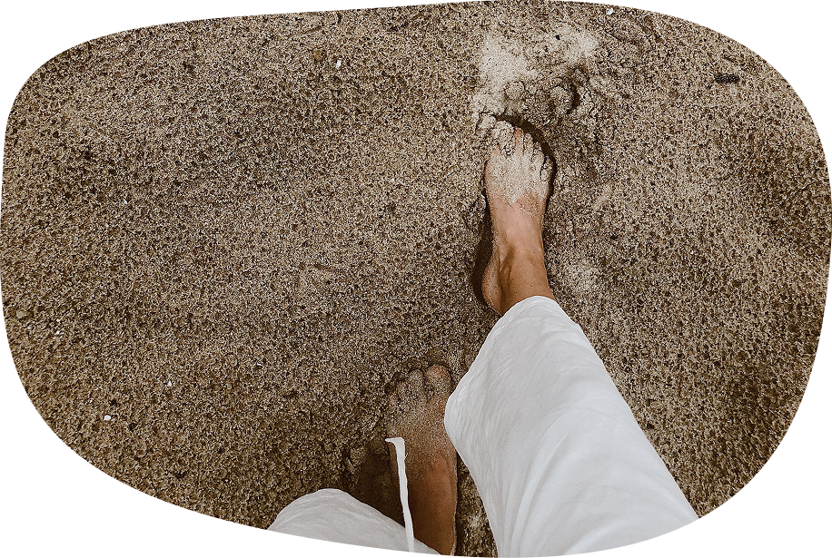 Image: Feet in sand at beach