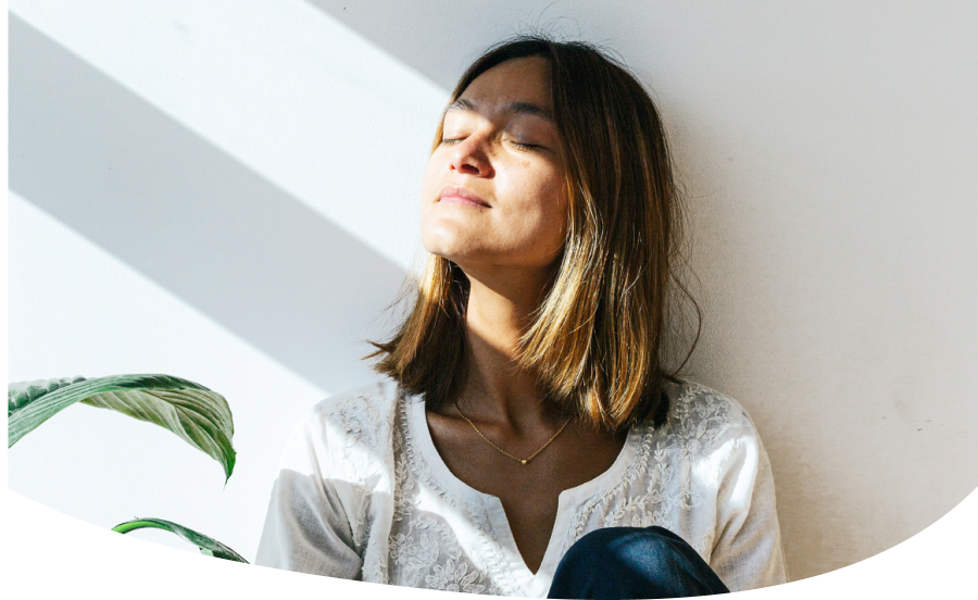 Image: Woman with eyes closed, facing window