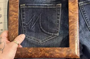 She places a frame over a denim pocket for a crazy-cool organization hack