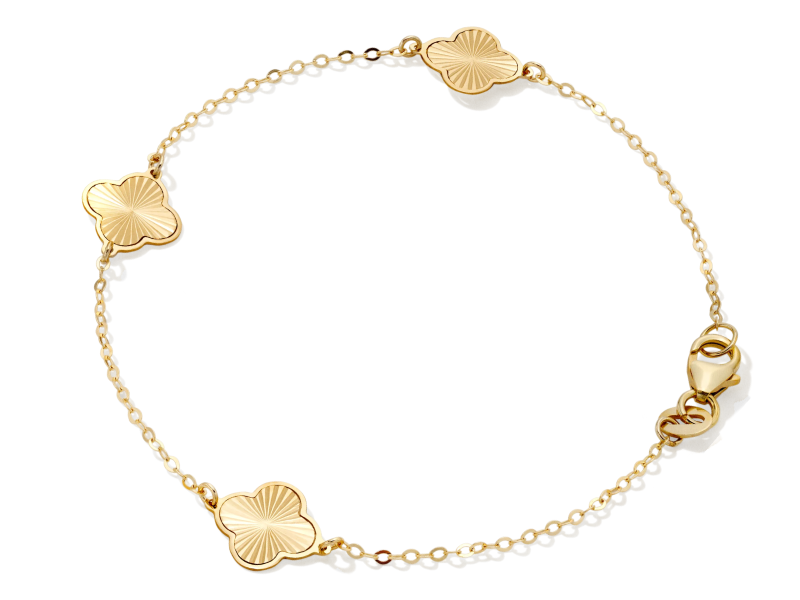 Yellow gold chain bracelet with clover shaped motif charms.