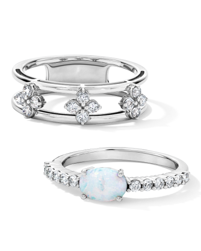 White gold rings featuring diamond floral clusters and oval opal center stone with pavé diamonds.