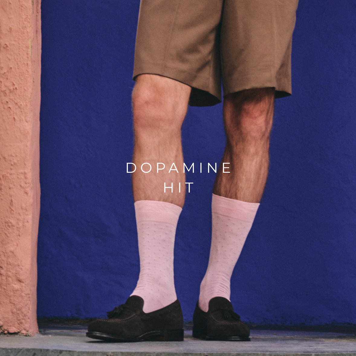 man in pink socks and shorts