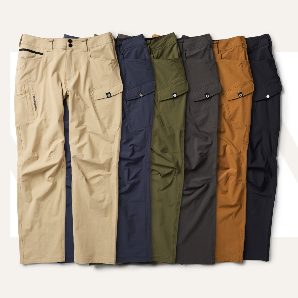 T1 WerkPants featured in (left to right): Light Khaki, Navy, Olive, Deep Grey, Sand, and Black