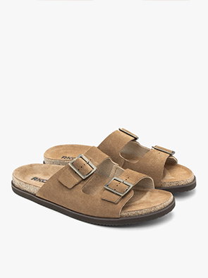 Pair of brown suede sandals with double buckle straps on a white background
