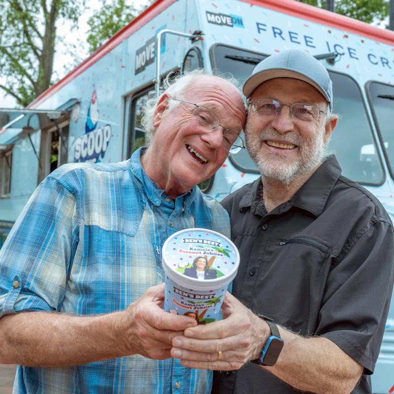 (L-R) Ben Cohen and Jerry Greenfield, co-founders of Ben & Jerry’s holding  each other and Ice Cream in a photo