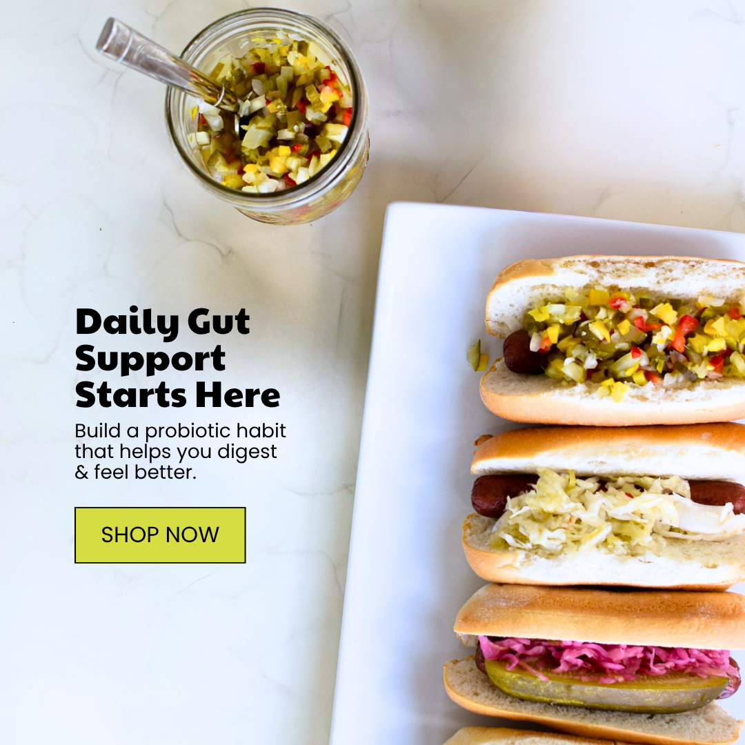 Overhead view of hot dogs with diverse toppings and a jar of relish, next to text promoting gut health.