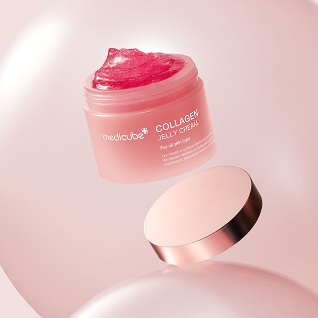 A pink jar of Medicube Collagen Jelly Cream with its lid off, displaying the gel texture against a pink background.