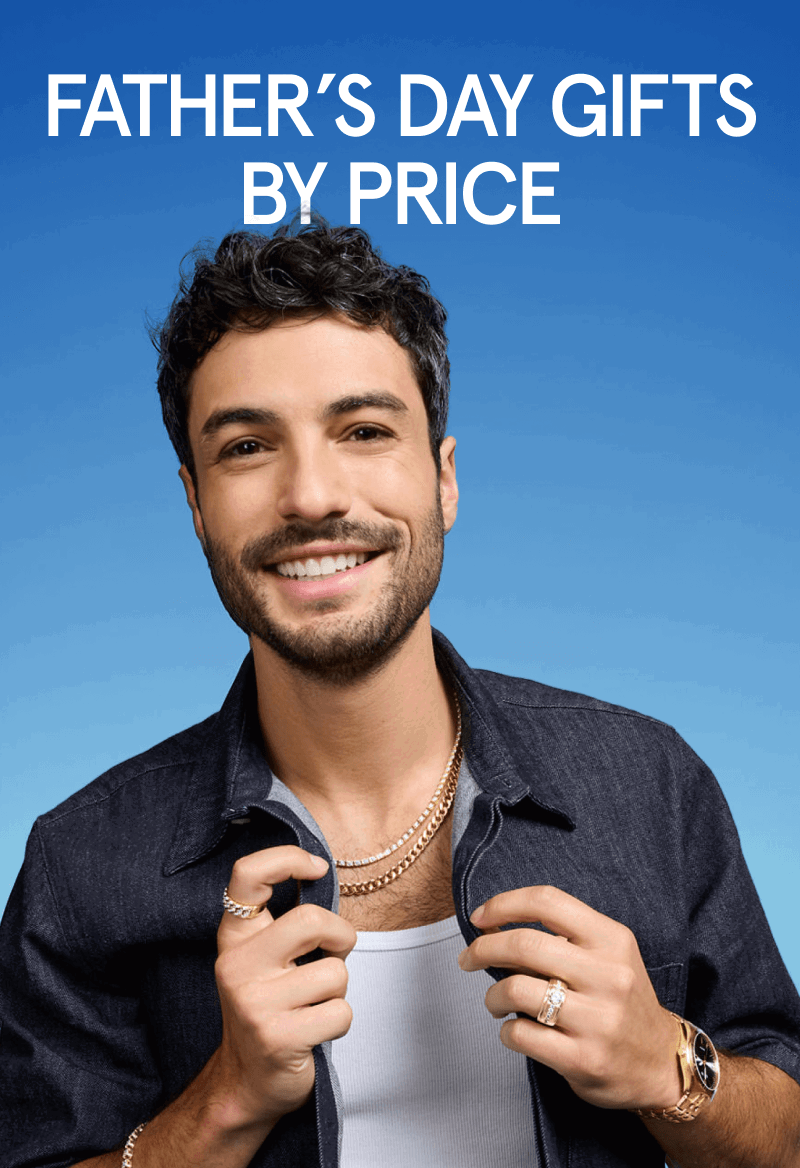 Male layered in gold & diamond jewelry, including a gold watch, diamond rings, necklaces & bracelet. Father’s Day gifts by price.