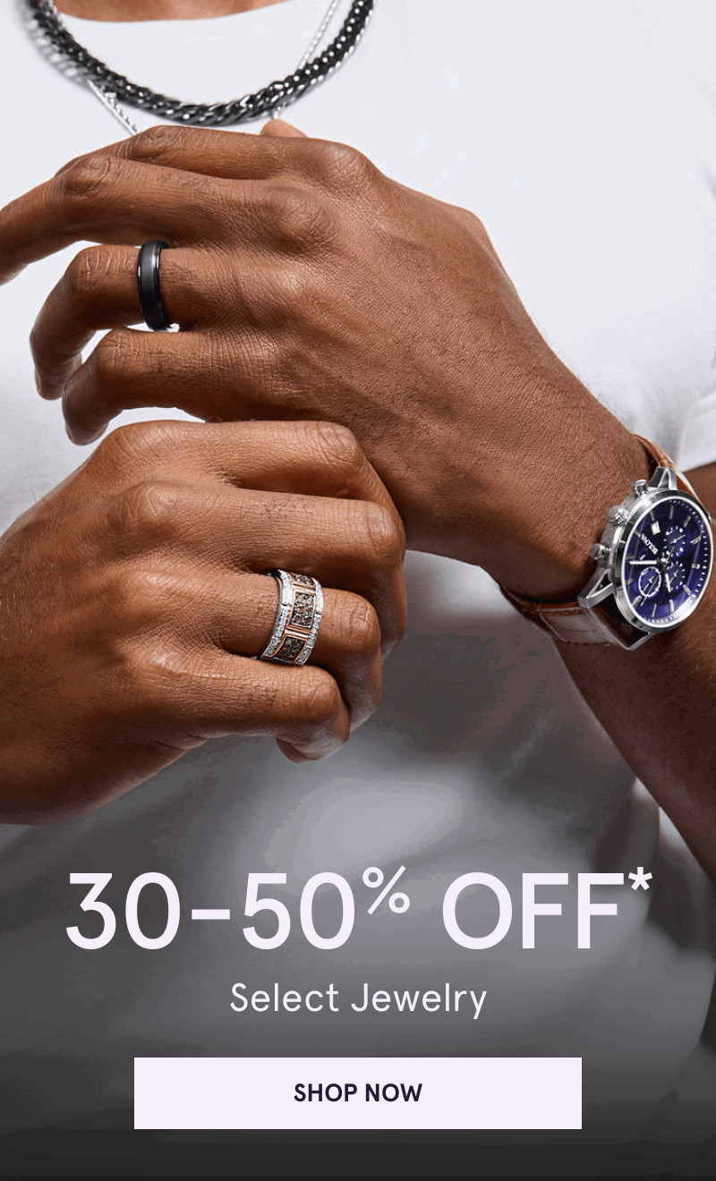 Male layered in blue-dial watch, two-tone ornate ring, matte black band & chain necklaces. 30-50% OFF Select Jewelry. Click here to shop now