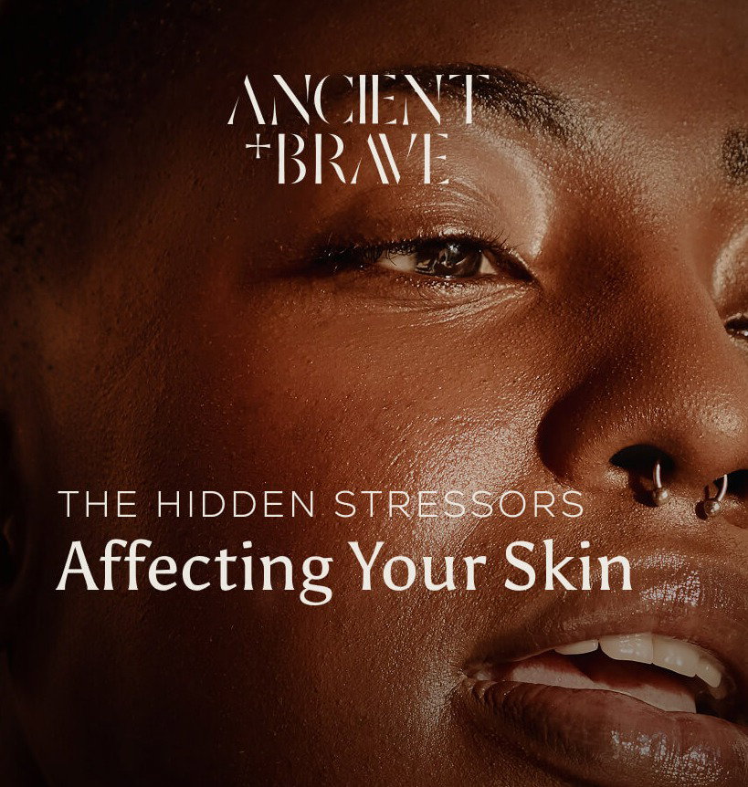 Ancient + Brave: A close-up portrait of radiant, glowing skin. Text overlay reads: The Hidden Stressors Affecting Your Skin