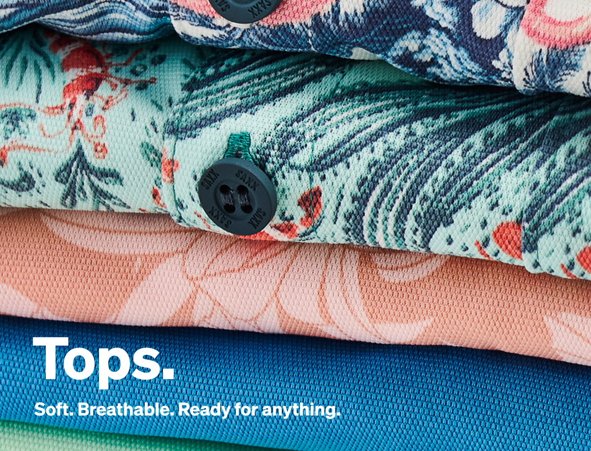 Stack of colorful SAXX tops featuring breathable performance fabrics and prints.