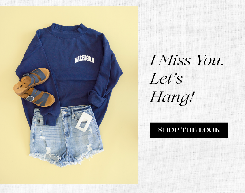 I Miss You, Let's Hang! Shop the look. Image of an outfit including 1897 Active Michigan Embroidered Mock Neck Sweatshirt for Women in Navy, KanCan x Glik’s Best Friend Fray Hem Distress Denim Shorts for Women, Soda Hanson Platform Sandals for Women in Navy, and Teleties Flat Rectangle Clip in Coconut White