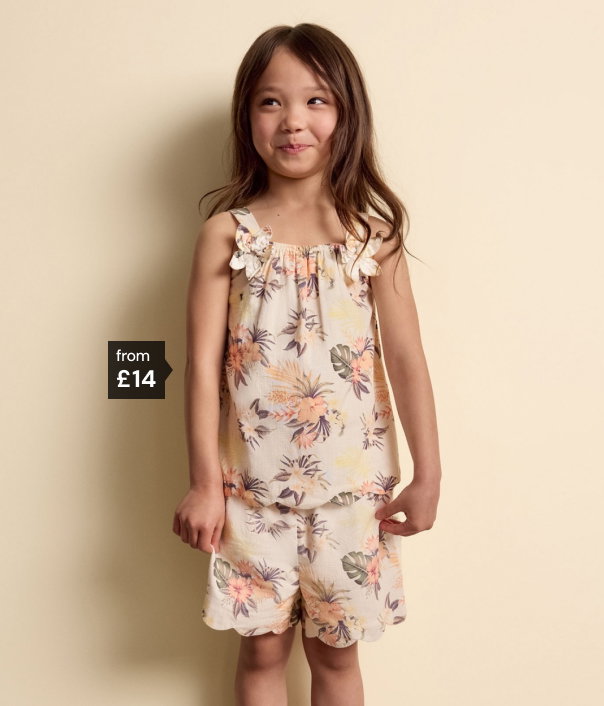 Girl wearing floral woven top and shorts outfit from £14.