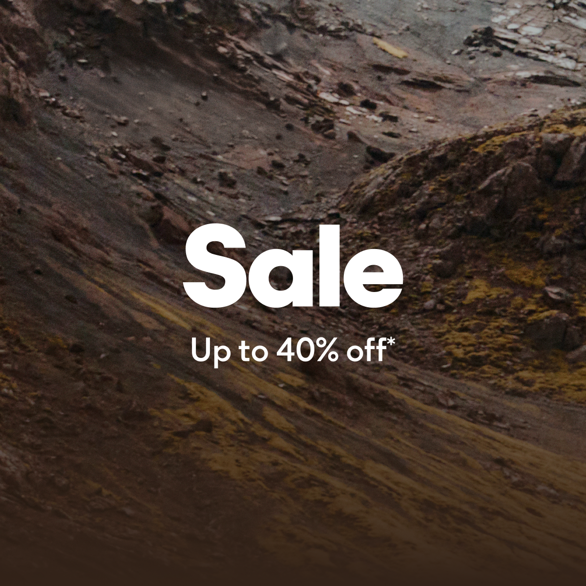 An image of a mountain side with rocky dirt paths with text overlayed on top 