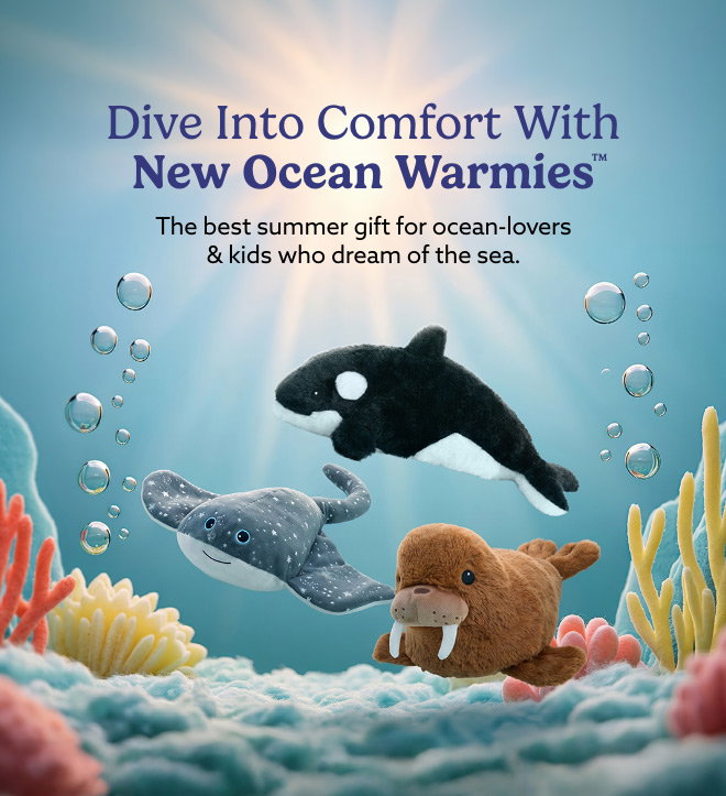 Sparkly Stingray, Orca, and Walrus Warmies swimming in the ocean. Shop Now.