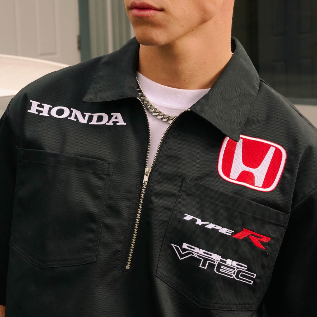 Shop Honda Racing | A black quarter-zip work shirt with the Honda emblem.