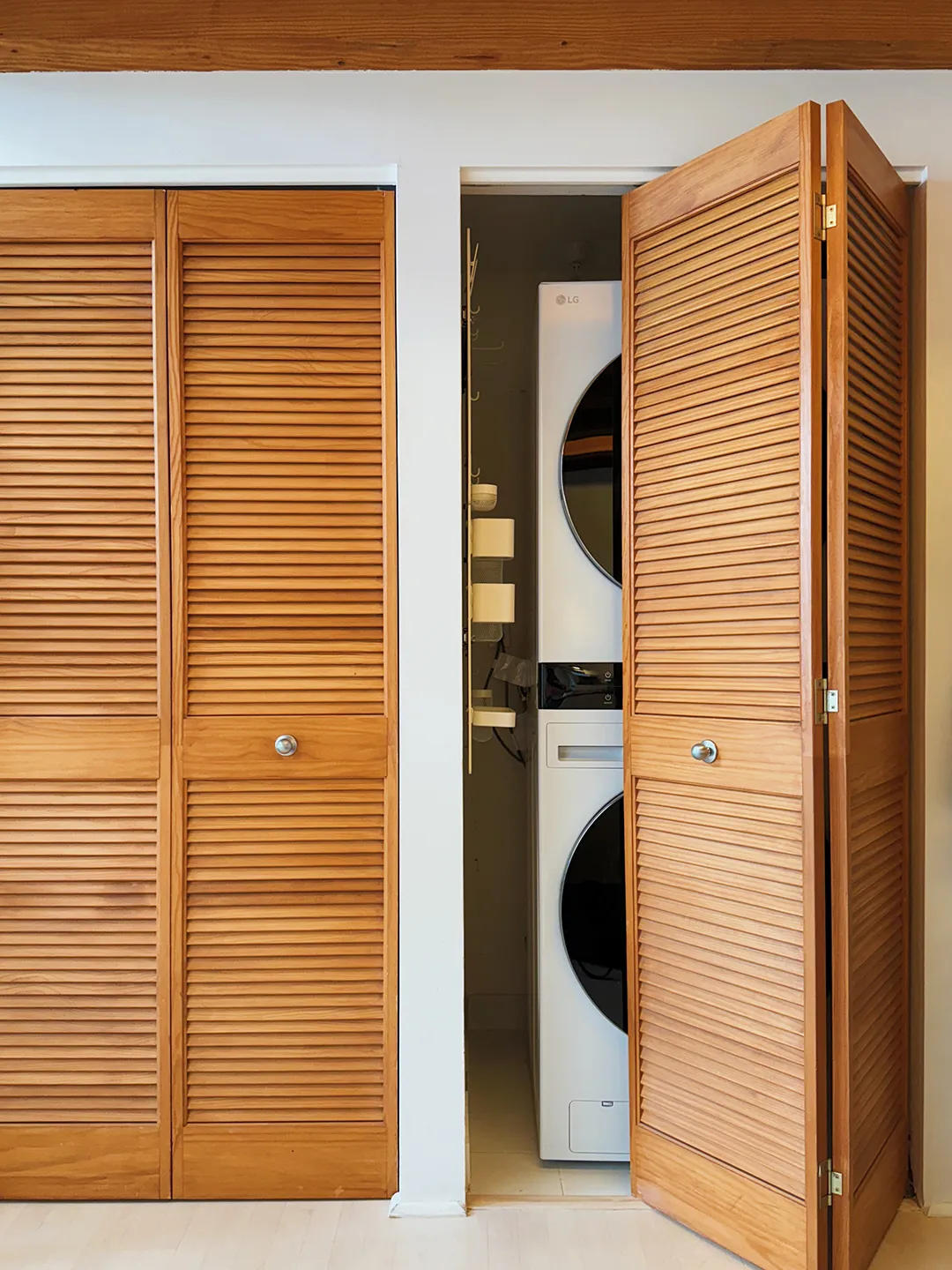 An IKEA Pegboard Was the Ticket to Storing Cleaning Supplies in This Narrow Laundry Closet
