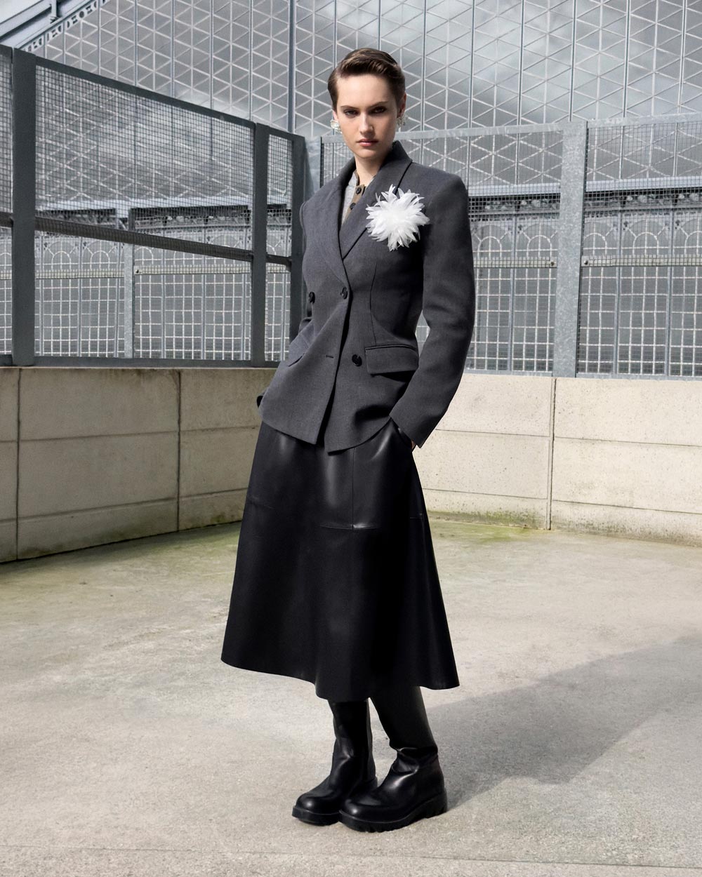 A picture of a woman wearing Black Faux Leather Midi Skirt