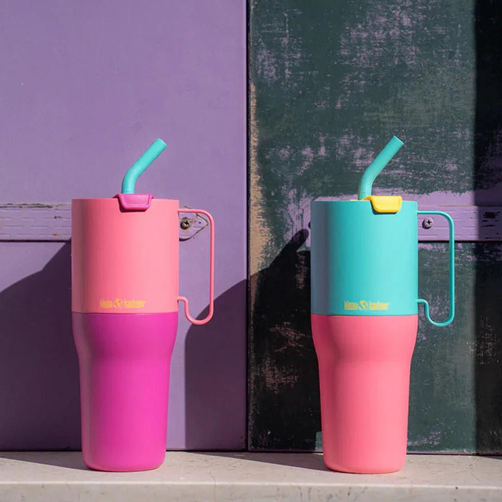 Two colorful Klean Kanteen insulated tumblers with straws against vibrant purple and teal backgrounds, showcasing newest collection designs.