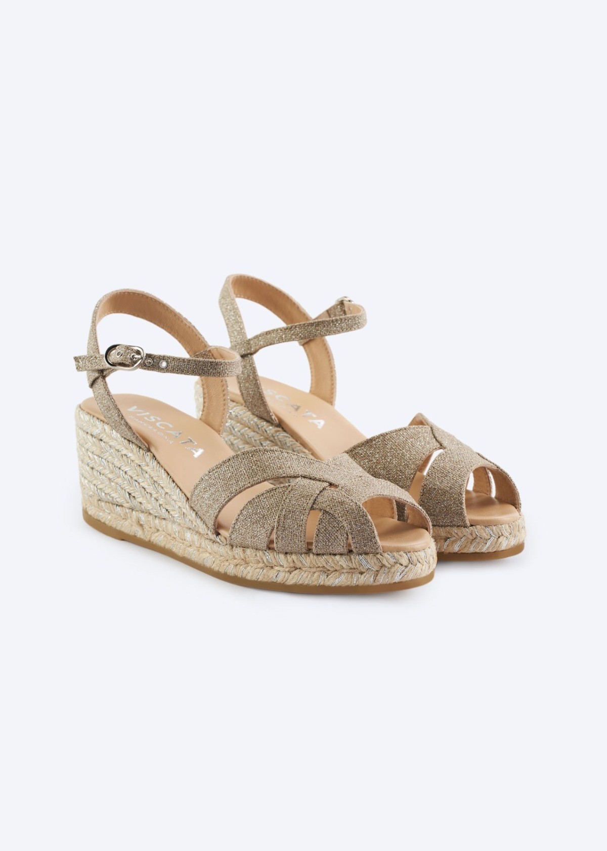 Champagne Laia glitter linen espadrille wedge sandals with open-toe crossover straps, an adjustable ankle strap, and a natural jute wedge braided with silver threads, handmade in Spain by Viscata.