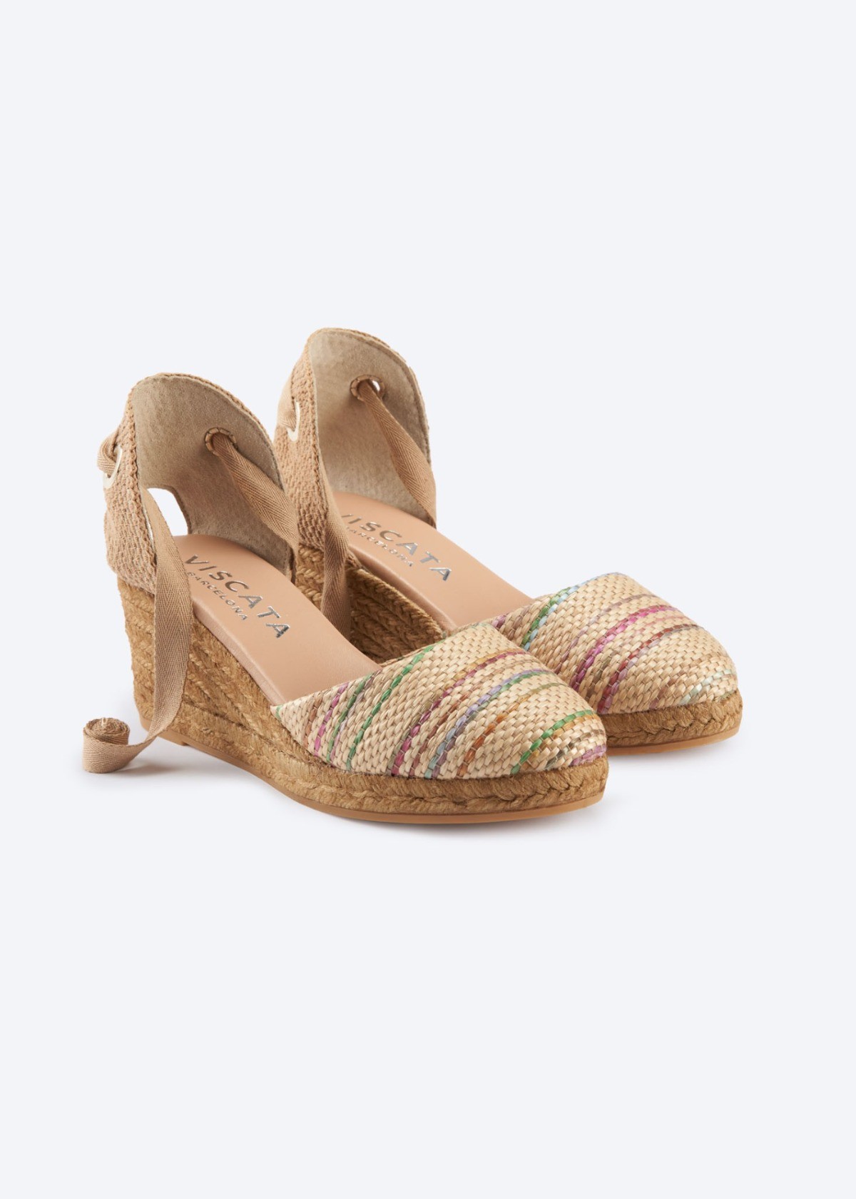 Multicolor Sagaro raffia lace-up espadrille wedges with closed rounded toes, wraparound ankle ties, and natural jute medium wedges, handmade in Spain by Viscata.