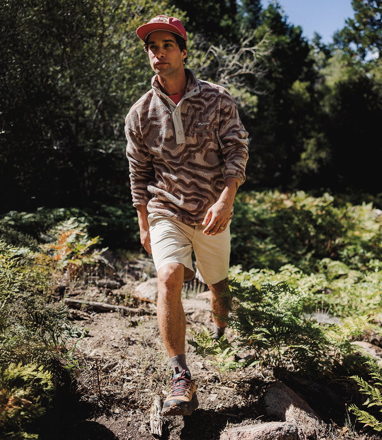 Three ROC shorts laid on top of a rock texted background