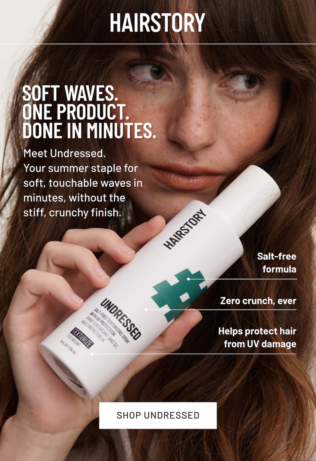 Image of model holding bottle of undressed