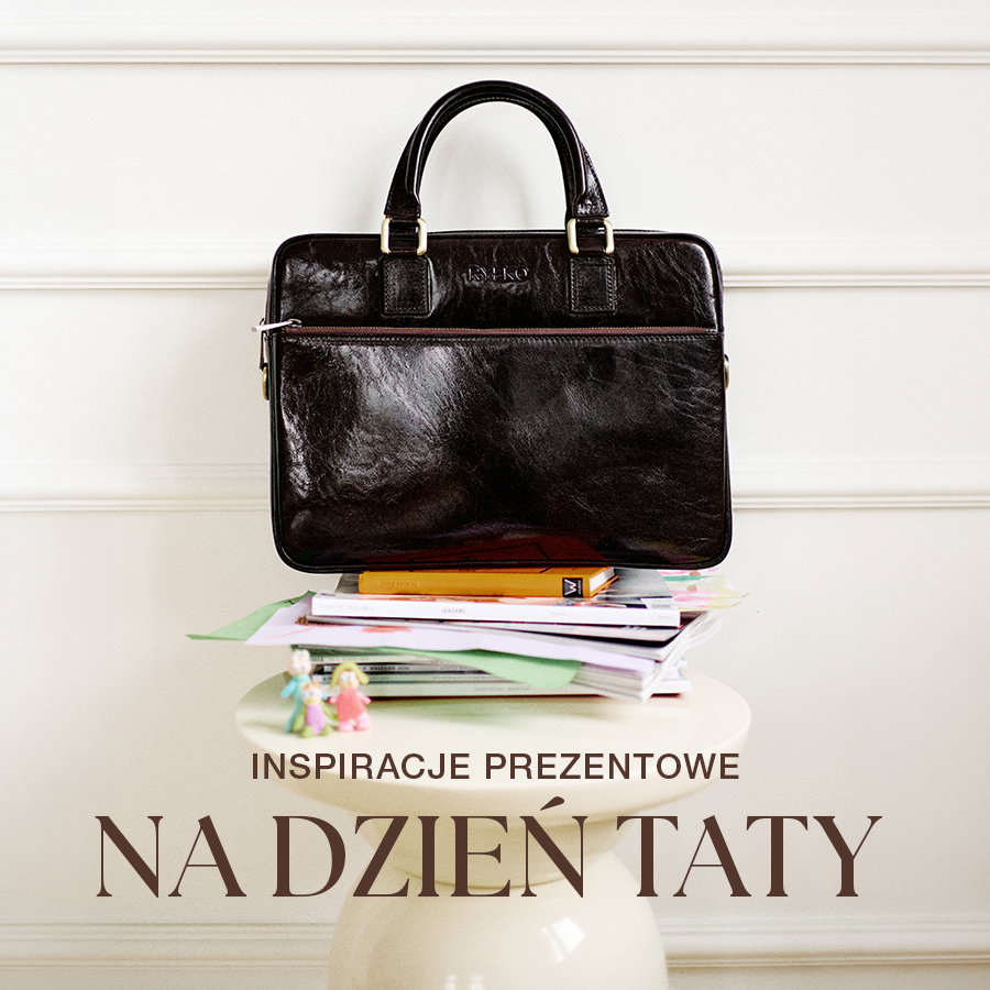 Black leather bag on a stack of magazines, gift inspiration for Father's Day