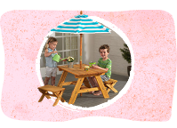 Kids playing on KidKraft picnic table with umbrella
