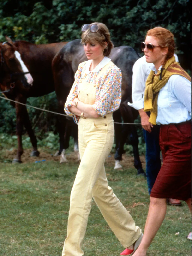 Image may contain: Sarah, Duchess of York, Diana, Princess of Wales, Person, Walking, Clothing, Pants, Adult, and Accessories