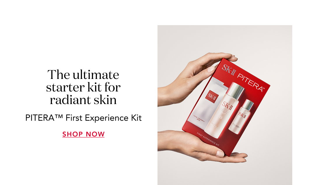 Hands holding SK-II PITERA™ First Experience Kit box with text “The ultimate starter kit for radiant skin” and “Shop Now.”