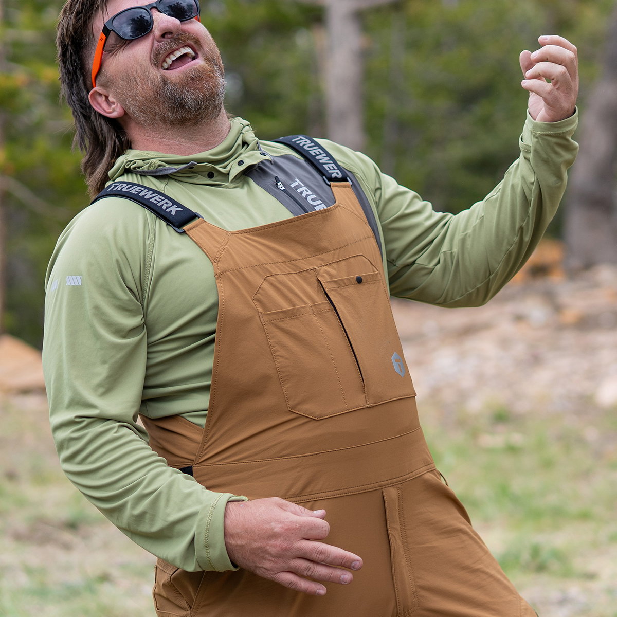 B1 Pro Sun Hoodie in Sage, paired with T1 Overalls in Sand