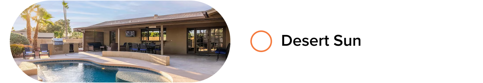 Desert-style home with curved pool, covered patio, outdoor grill, and lounge seating.