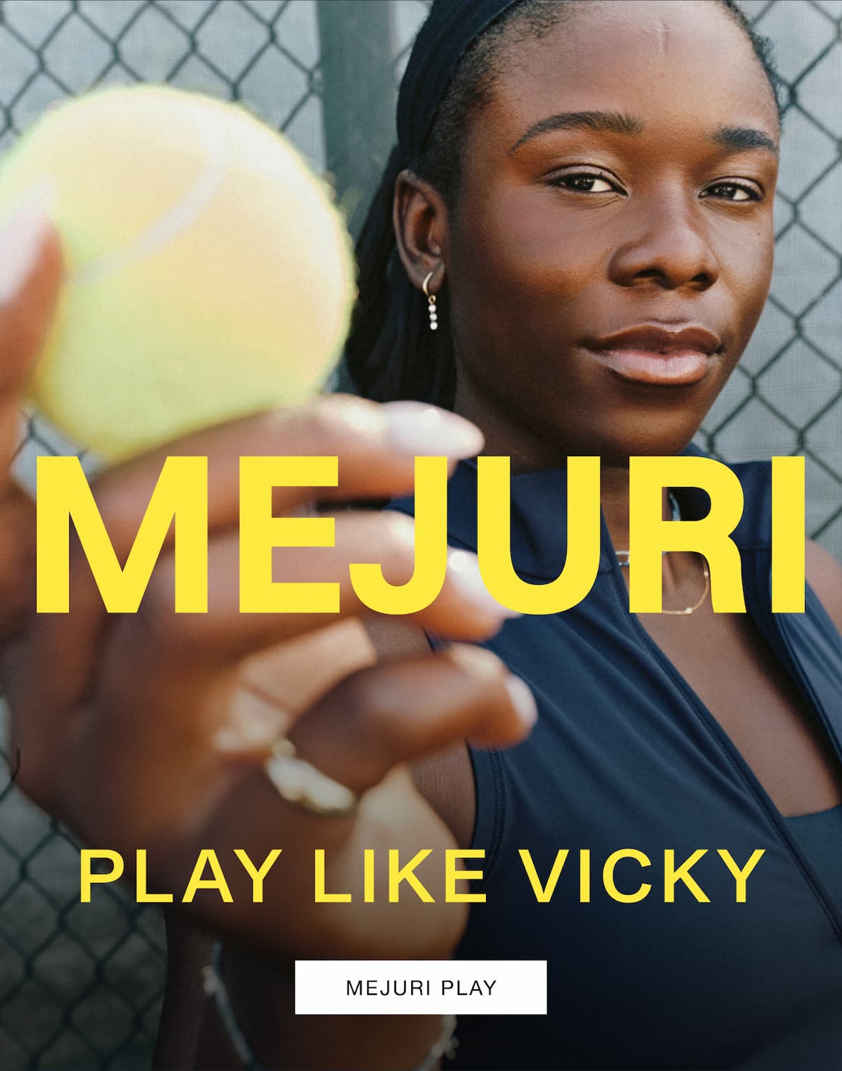 Vicky on a tennis court holding a tennis ball toward the camera wearing a Mejuri diamond drop earring — Mejuri, Playing Like She Means It, Mejuri Play.