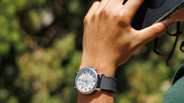 someone wearing a grey elite silicone watch band