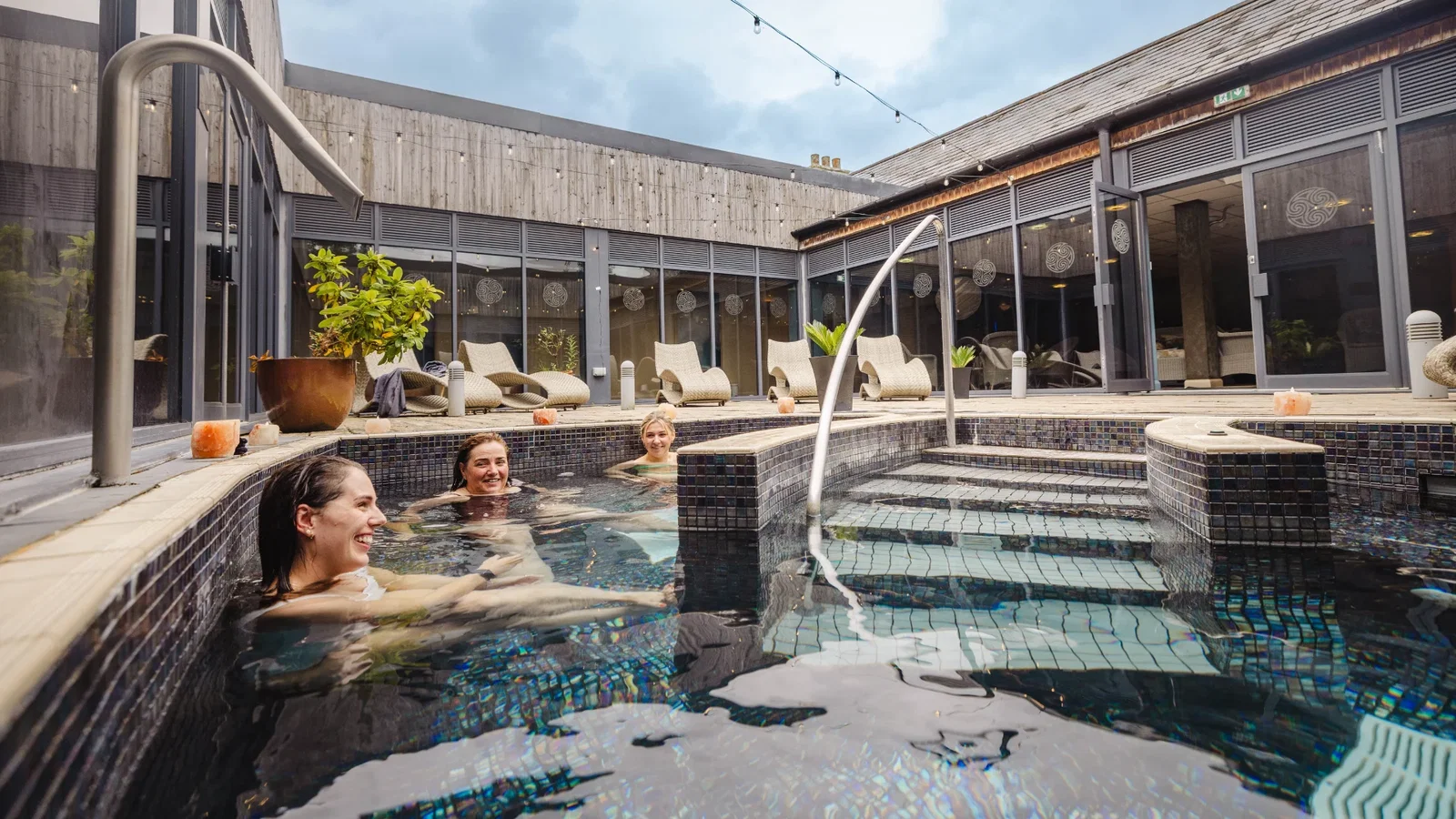 Friends enjoying the well spa outdoor pool