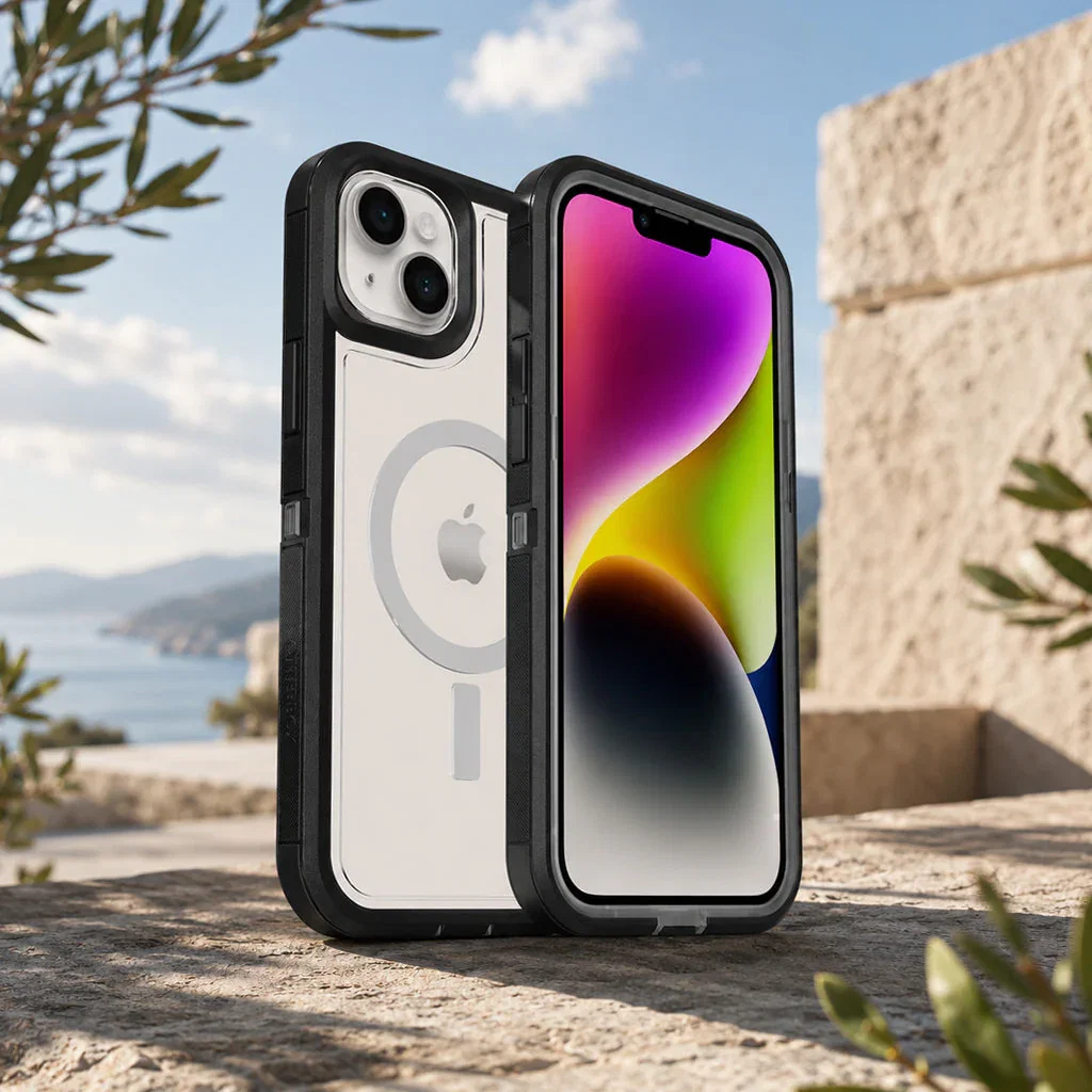 iPhone 13 in white with black protective case displaying colorful gradient screen, positioned outdoors by coastal architecture.
