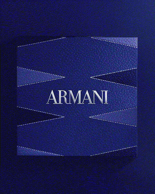  A front-facing shot of the Acqua di Giò Eau de Toilette bottle by Giorgio Armani. The frosted glass bottle sits against a textured blue background featuring silver metallic lines and circular leather-like accents, evoking a sophisticated and fresh aesthetic.