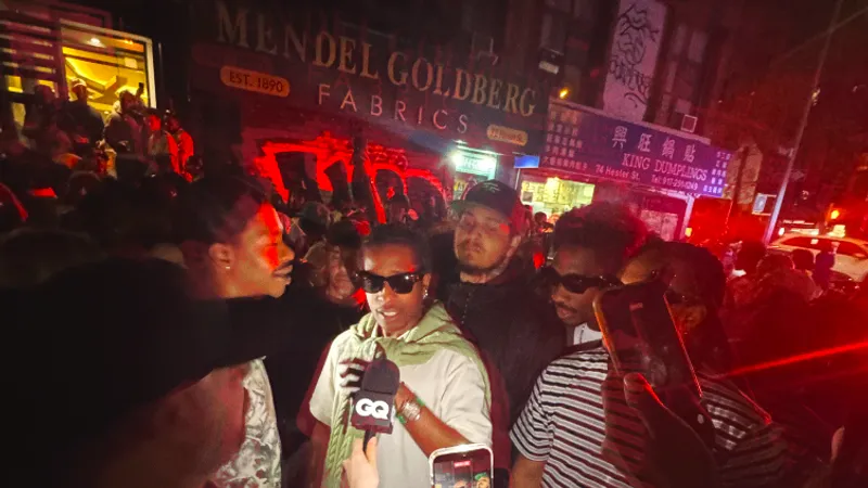 Image may contain: A$AP Rocky, Urban, Club, Adult, Person, Accessories, Sunglasses, Pub, Night Club, and Electronics