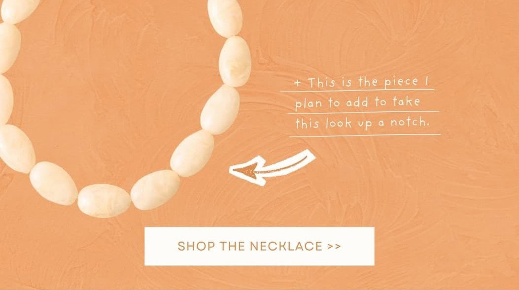 Image of a Marbled Ivory Beaded Statement Necklace. Shop the Necklace.